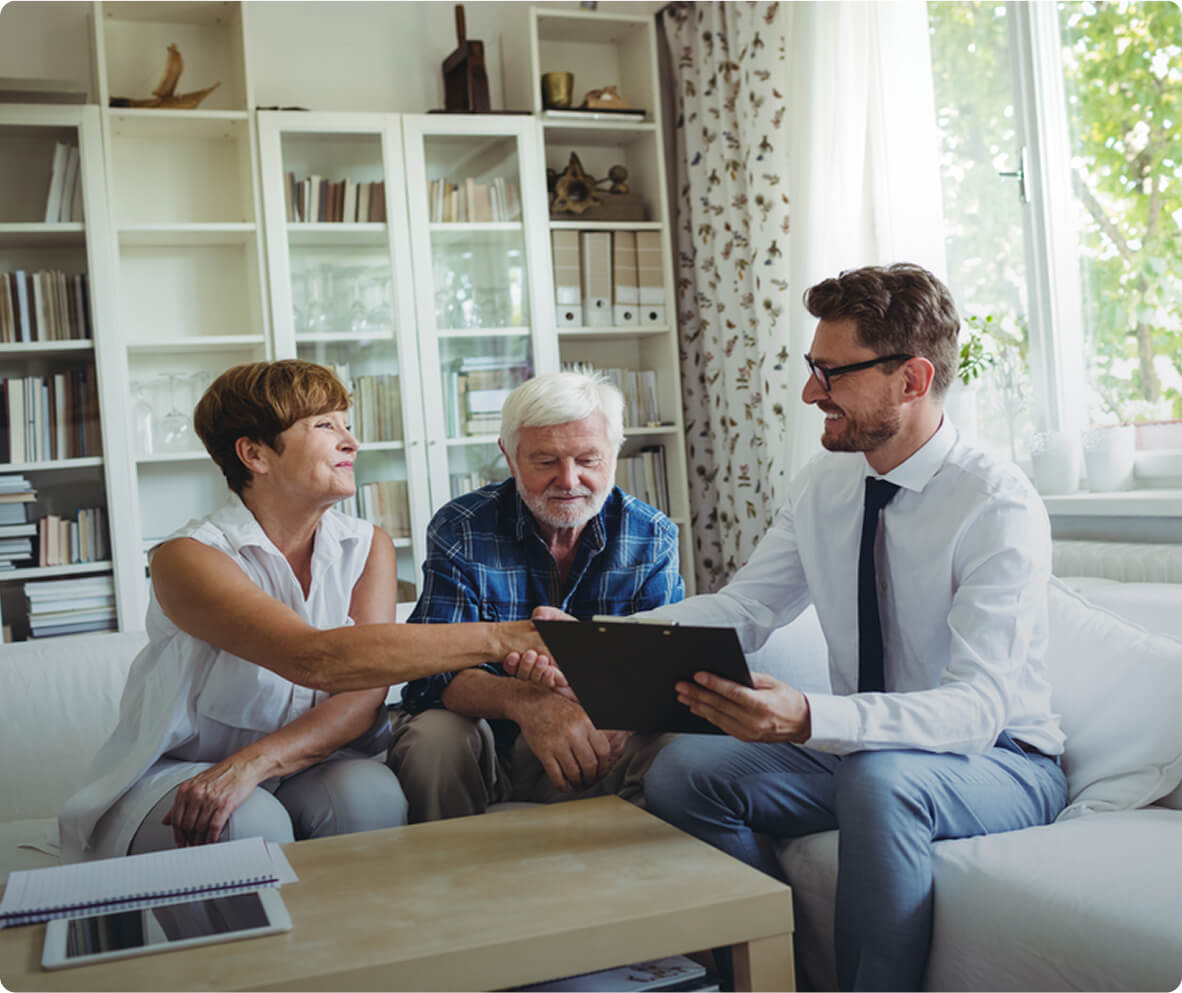 Financial Advisor Shaking Hands Senior Woman